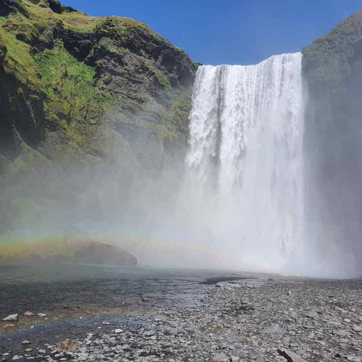 Island Skogafoss mit Regenbogen